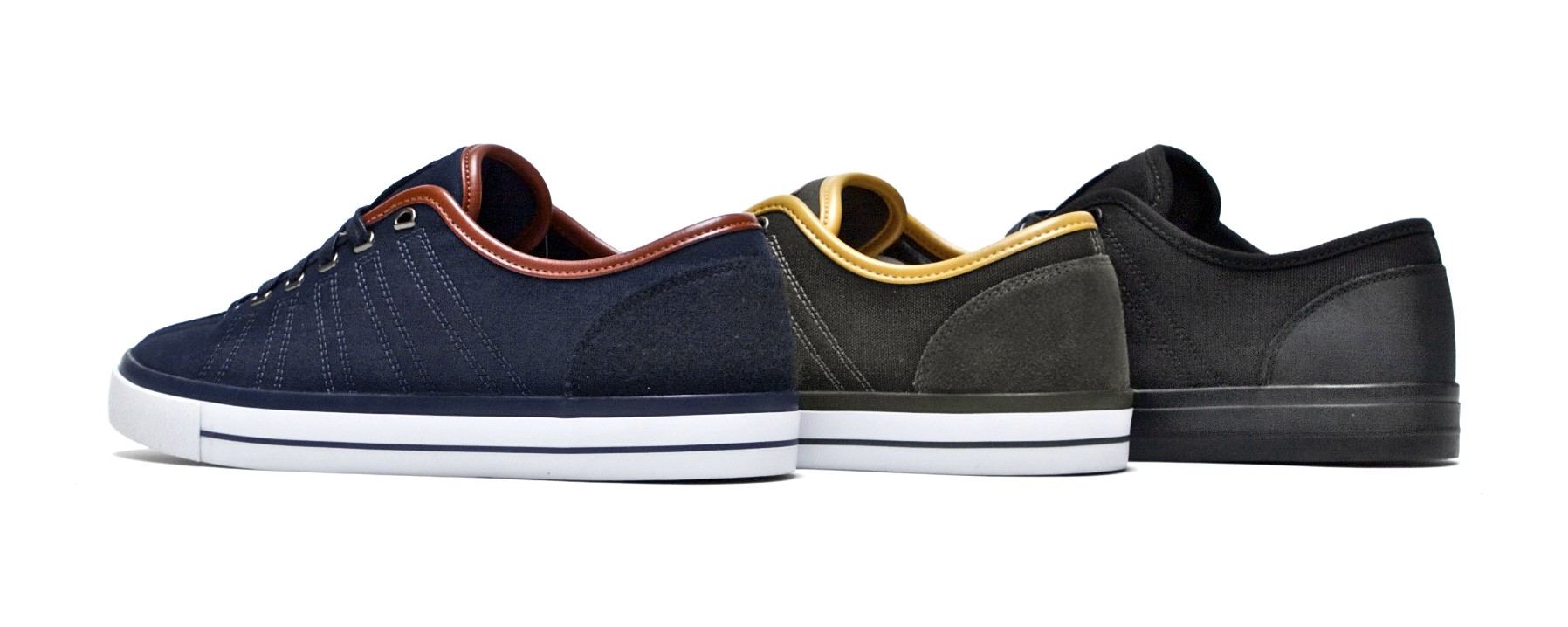 Three CA Classic lows in navy, olive with a yellow collar, and black.