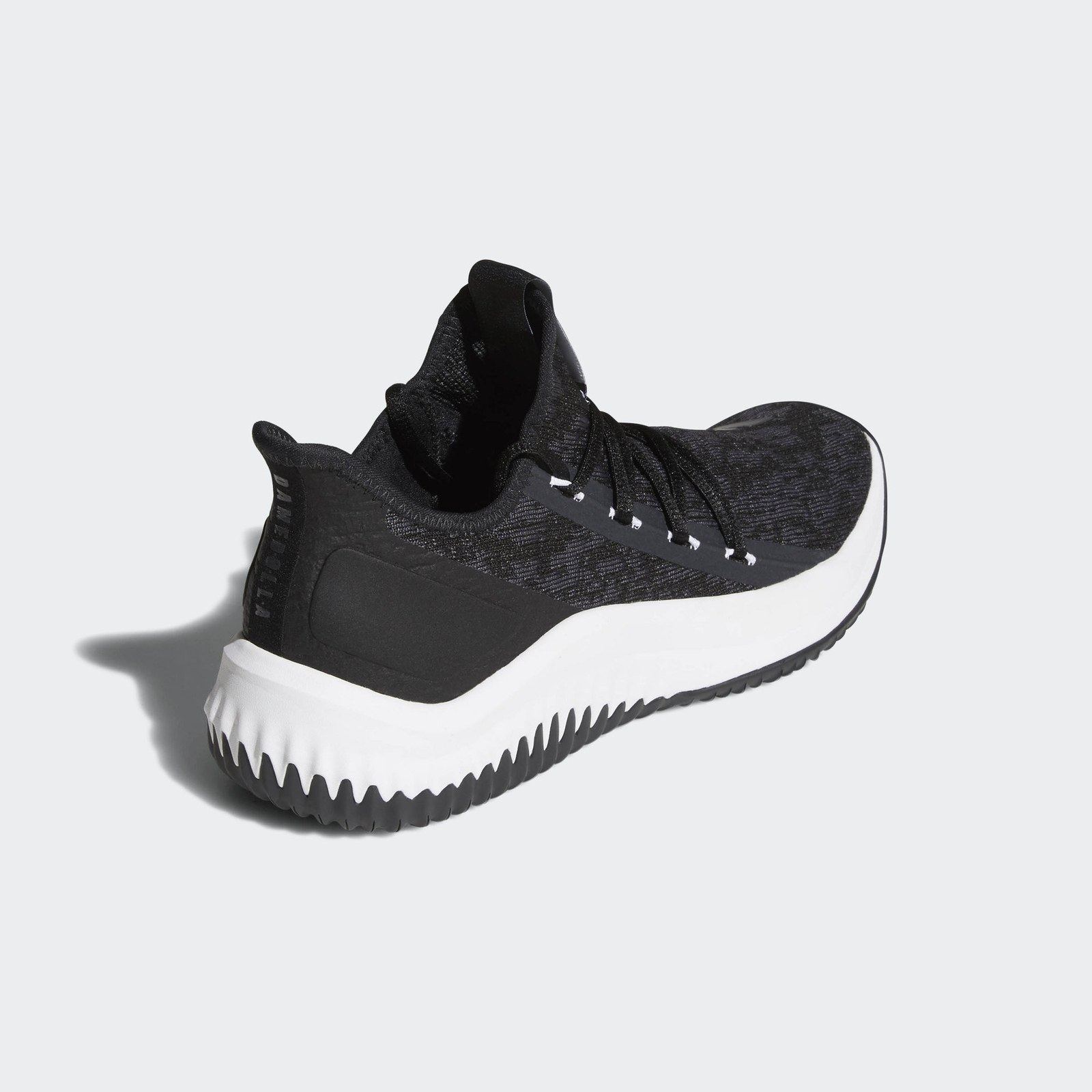 The core black shoe, three-quarter view from the heel.