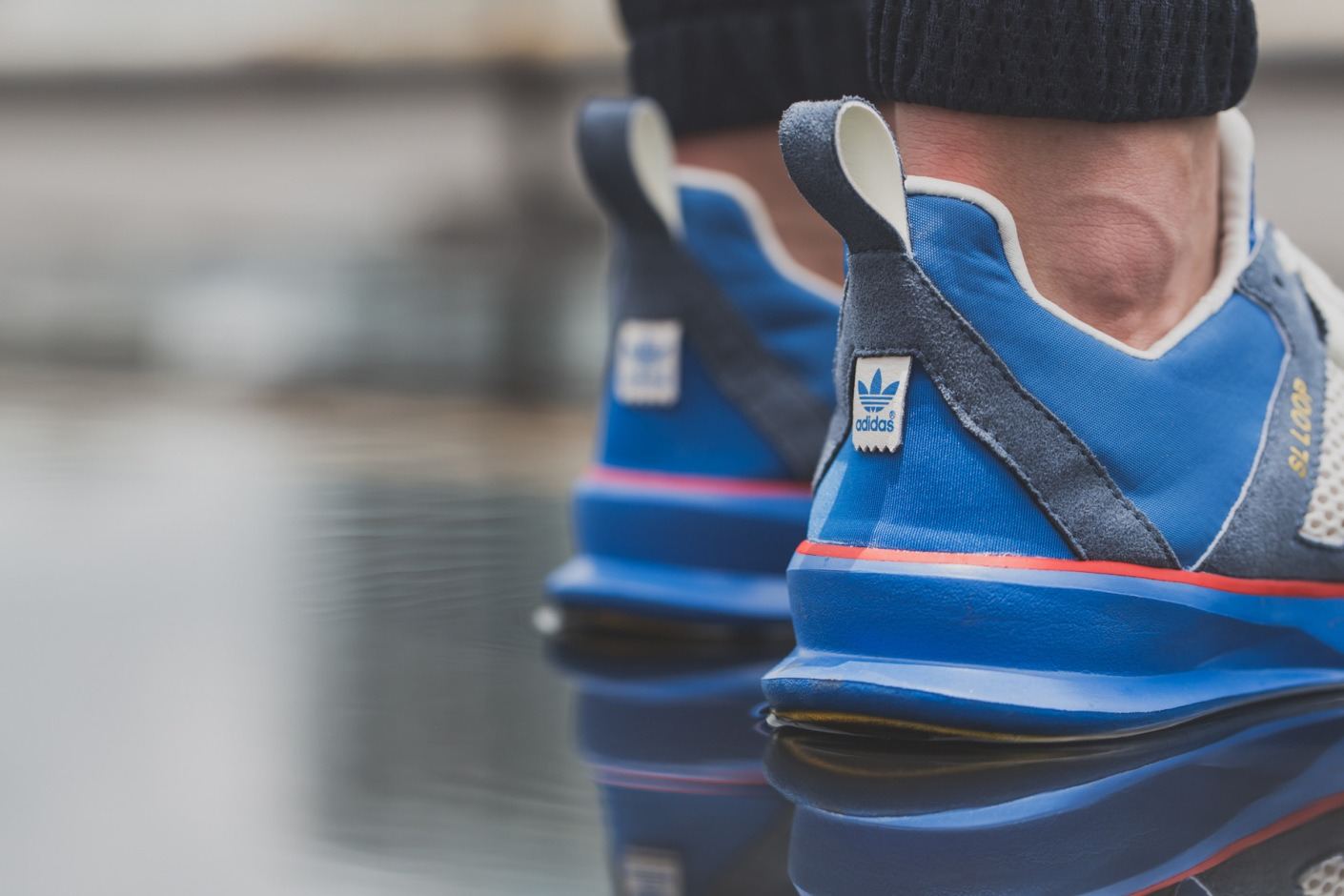 Close-up of the blue suede heels and pull loops.