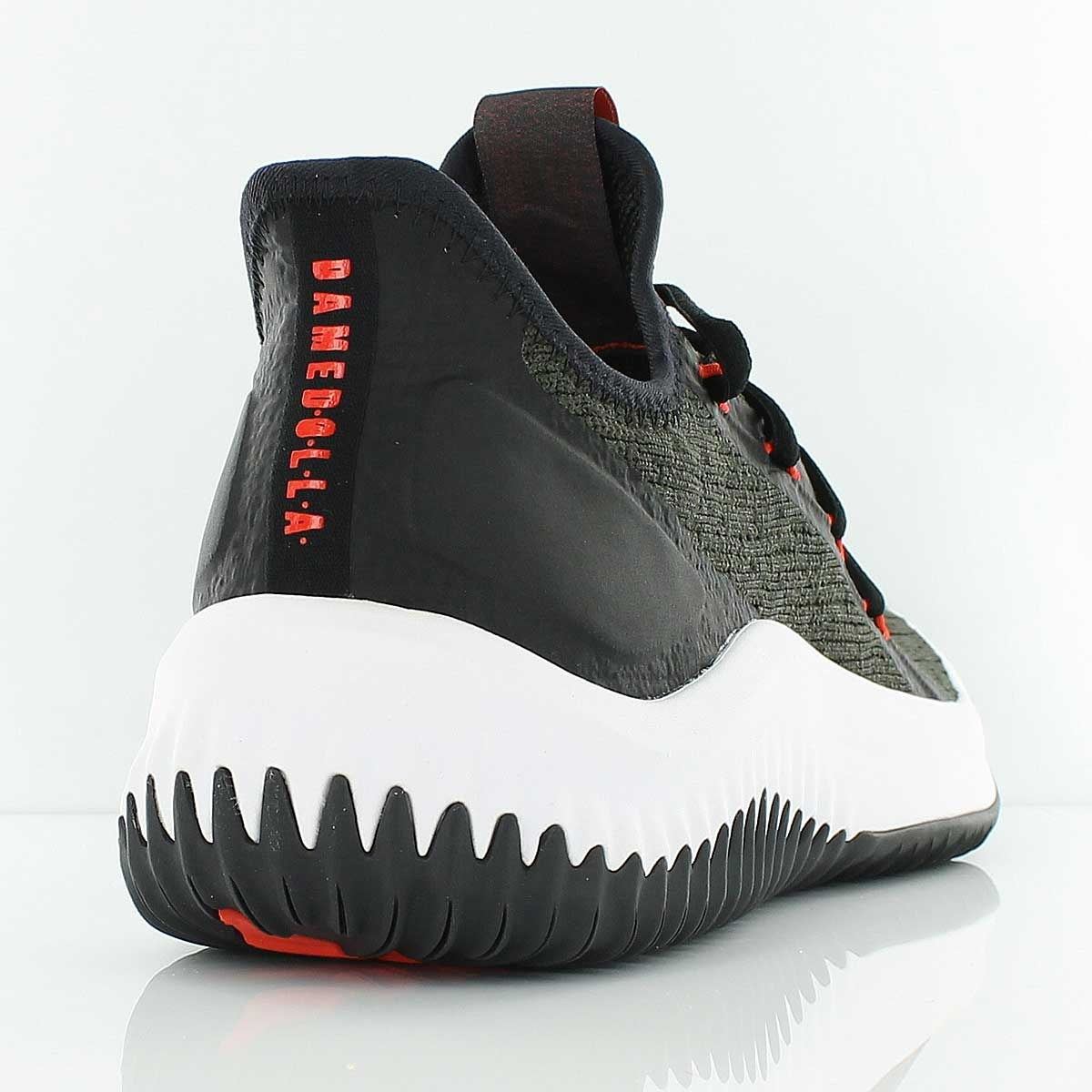 The night cargo heel, with D.O.L.L.A. printed in red down the heel and red at the base of the outsole.