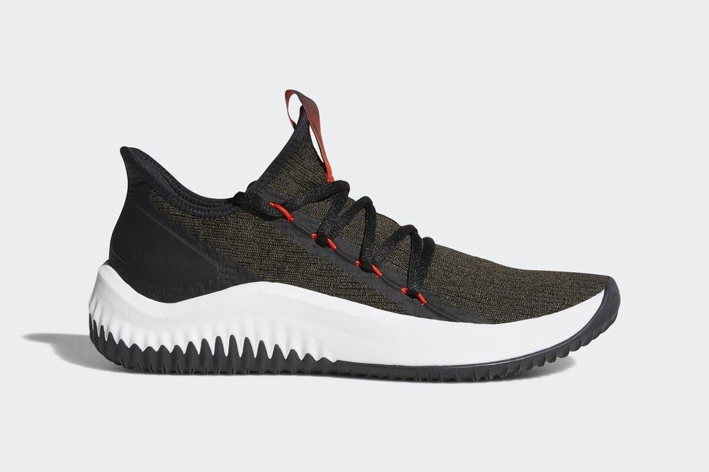 The night cargo Dame D.O.L.L.A. from the side, olive knit with a black heel, red pull tab and white midsole.