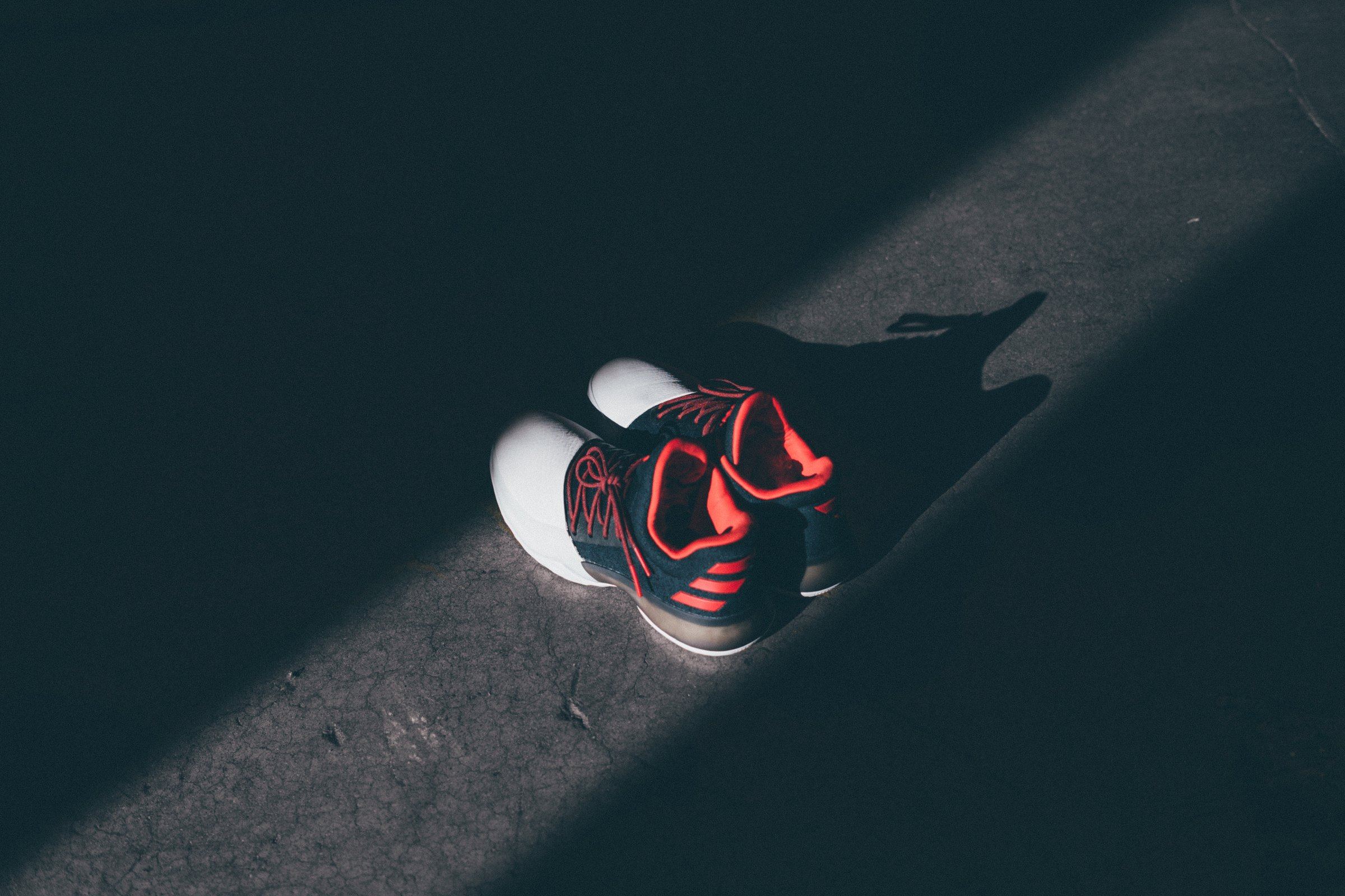 Harden Vol. 1 in black, white, and red on a dark gym floor, lateral side.