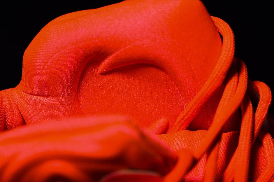 Macro of the orange tongue and laces.