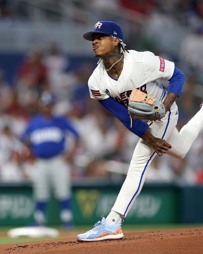 Marcus Stroman pitching in the Puerto Rico colorway cleats.