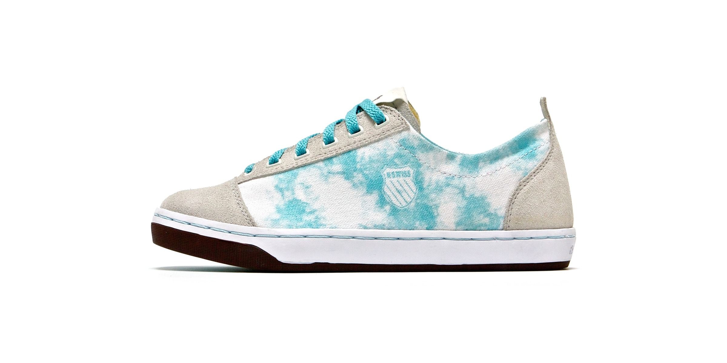 The Slyon low in grey suede and turquoise tie-dye canvas with turquoise laces and a brown sole, side view.