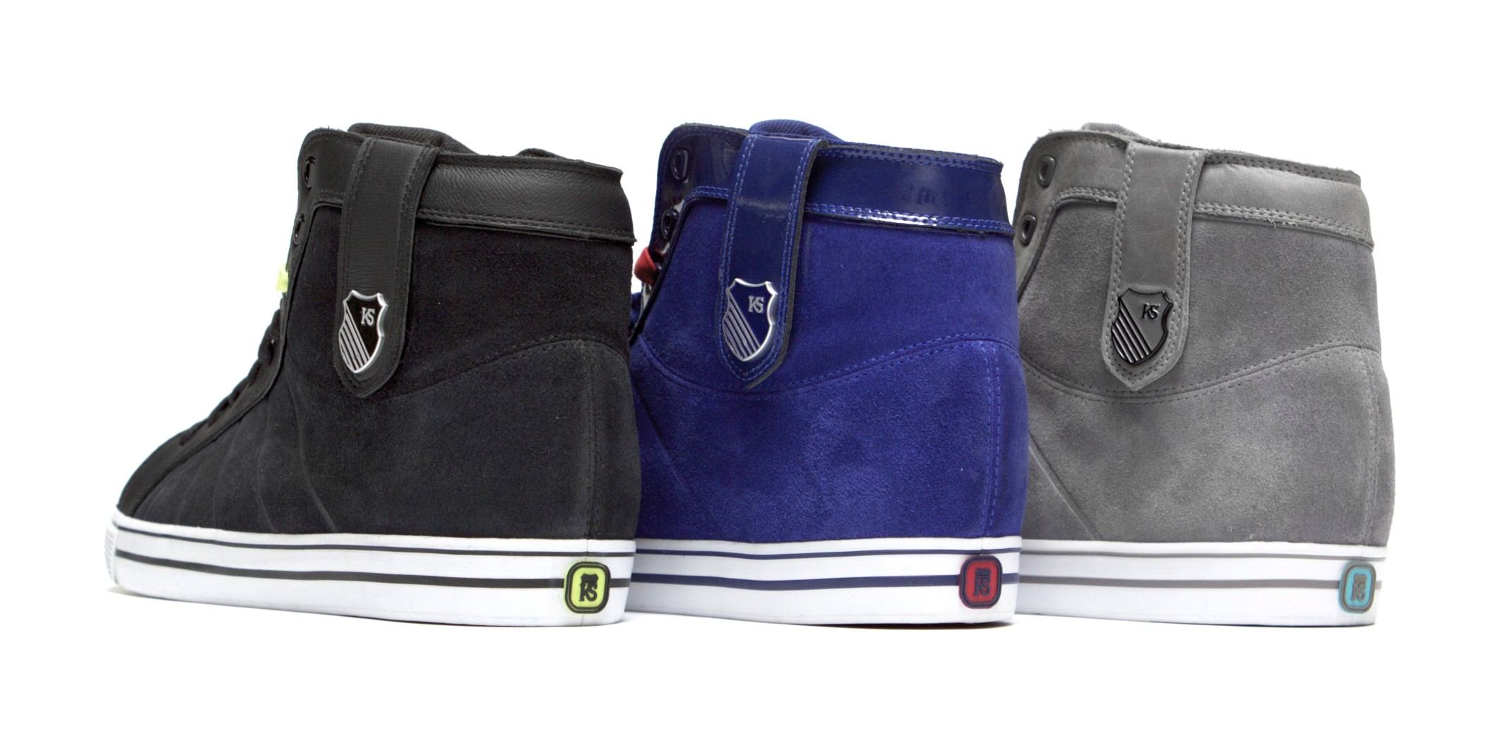 Heels of the black, blue and grey HWD Mids, each with a colored heel badge.
