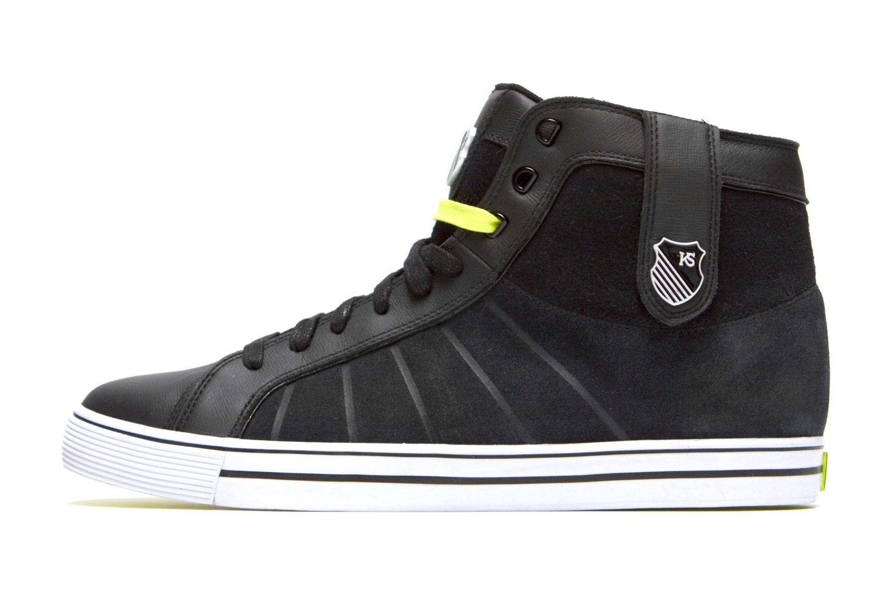 The black HWD Mid from the side, with suede and leather panels, a collar strap with a KS shield and a neon yellow lace.