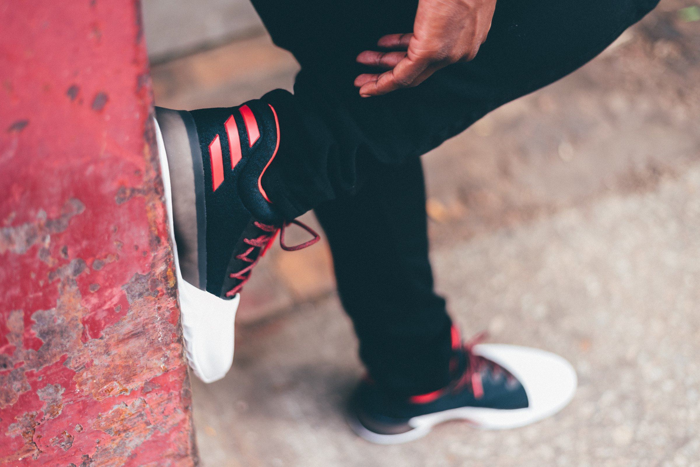 Harden Vol. 1 worn against a weathered red post.